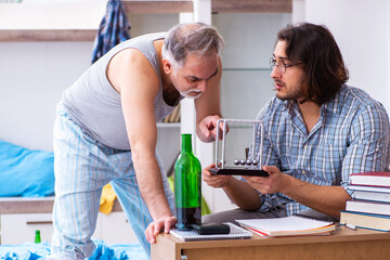 Young son student and dad alcoholic