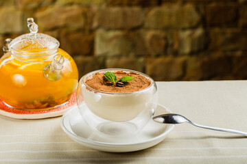Fresh dessert with cocoa in a transparent bowl.