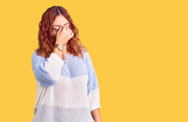 Young latin woman wearing casual clothes tired rubbing nose and eyes feeling fatigue and headache....