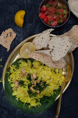 Indian vegan lemon rice pilaf with papad and side salad