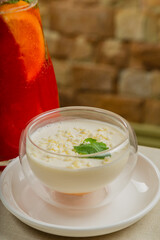 Fresh dessert with white chocolate in a transparent bowl.