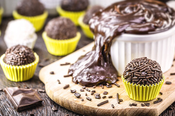 Brigadeiros or negrinhos, sweets typical of children's birthday parties in Brazil, with chocolate around them. Brazilian cuisine.