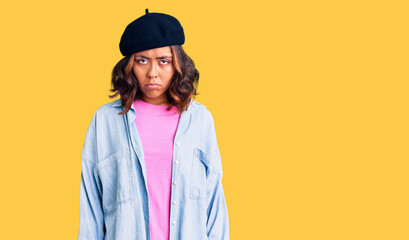 Young beautiful mixed race woman wearing french look with beret skeptic and nervous, frowning upset because of problem. negative person.
