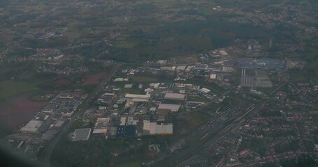 Montreal, Canada - September 2, 2019 urban and rural areas from window view of airplane flying at low altitude after taking off from Trudeau Airport.
