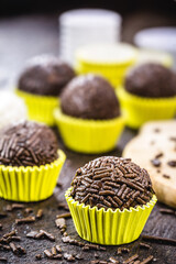bonbon typical of brazil, known as brigadeiro or negrinho, made of chocolate and sugar in a layer of sprinkles.
