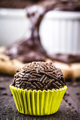 bonbon typical of brazil, known as brigadeiro or negrinho, made of chocolate and sugar in a layer of sprinkles.