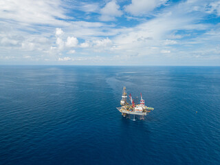 Aerial view from a drone of an offshore jack up rig at the offshore location during day time