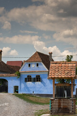 Fototapeta na wymiar houses painted in blue in Roadeș, Brașov, Romania 2019