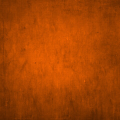 Texture for artwork and photography. Abstract burnt orange stained paper texture background or backdrop.