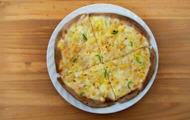 homemade peasant pizza with onion, corn and pepper