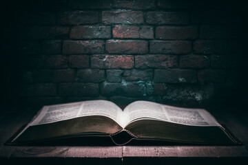 Holy Bible over a wooden table - 374770808