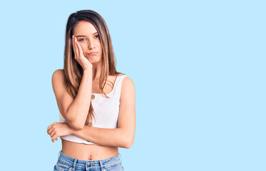 Young beautiful girl wearing casual sleeveless t shirt thinking looking tired and bored with depression problems with crossed arms.