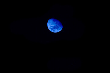 Blue Moon in the dark sky, blue moon in the night sky, blue and dark in the sky