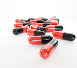 Antibiotics Black Red capsules pills isolated on white background.