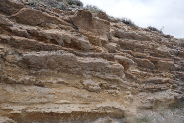 Jagged stone side of cliff