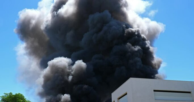 Black smok over a factory burning, Aigues Mortes, Occitanie, France