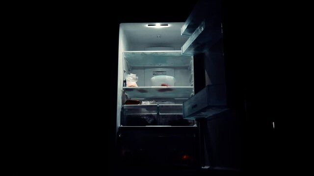 fridge door opening in a dark place
