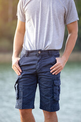 Asia man in bermuda shorts and t-shirt, outdoor activity concept
