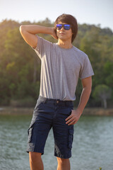 Asia man in bermuda shorts and t-shirt, outdoor activity concept