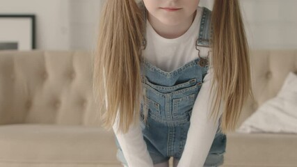 Little girl in denim and a long hair