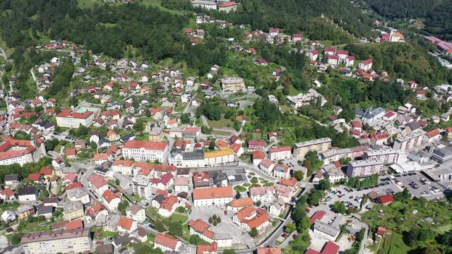Panoramic view of small Slovenian town Idrija on sunny day