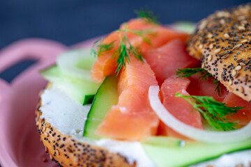 Cream cheese everything bagel with smoke salmon, onions, and dill pepper.