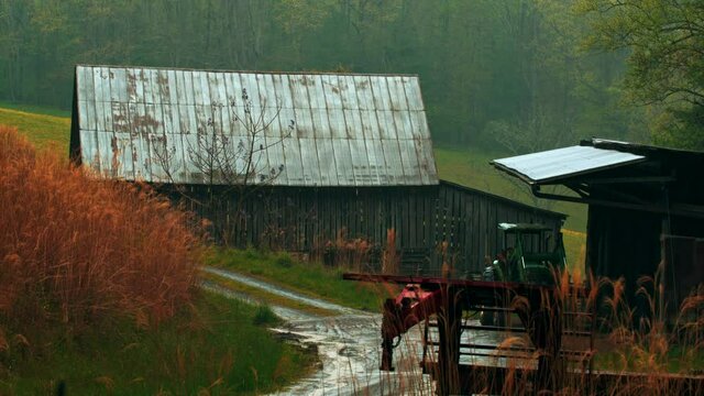 Barn getting rained on in the mountains.
