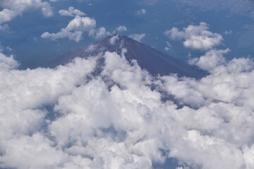 Naklejka na ściany i meble The view of Mount Fuji from an airplane in Japan