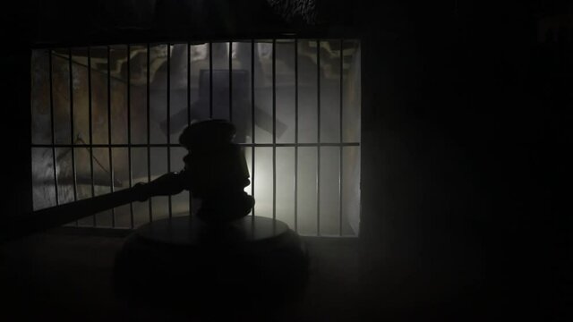 Execution with Lethal injection concept. Death penalty lethal injection table miniature inside old prison. Old prison bars cell lock. Creative artwork decoration. Old grunge prison interior.