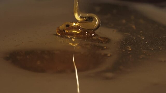 pouring honey on honey slow motion 4k