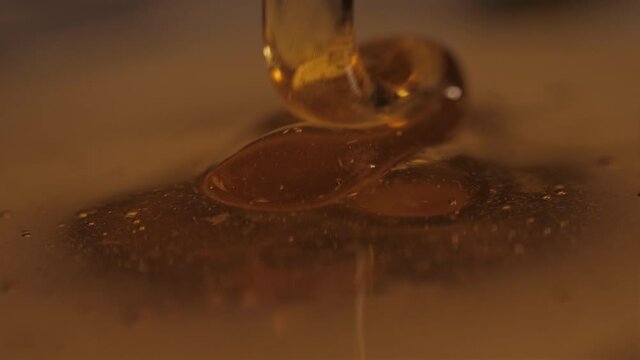 pouring honey on honey slow motion 4k