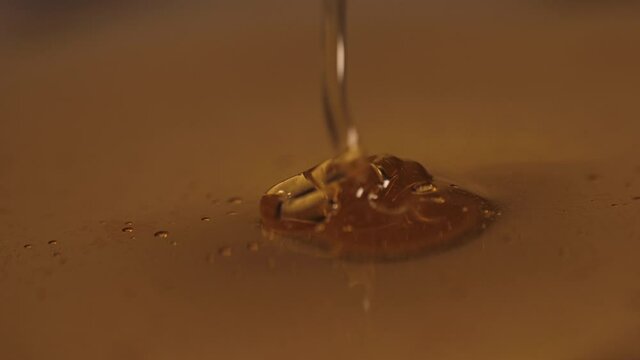 pouring honey on honey slow motion 4k