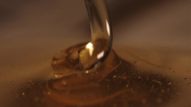 pouring honey on honey slow motion 4k