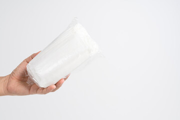 Hand holding pack of medical protective mask