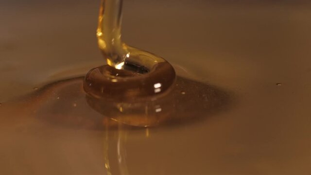 pouring honey on honey slow motion 4k
