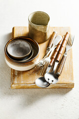Modern ceramic tableware and old utensils.