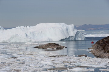 Iceberg and ice floe in Disko Bay, Ilulissat, Greenland.