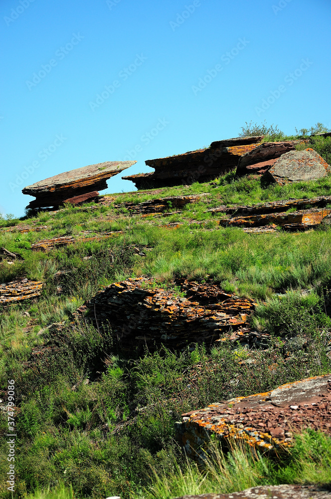 Wall mural Two flat stones on a pedestal forming the landmark of the ancient observatory at the top of the hill.