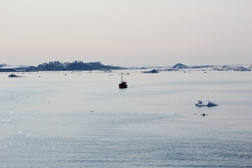 Ship sailing on Disko Bay, Ilulissat, Greenland.