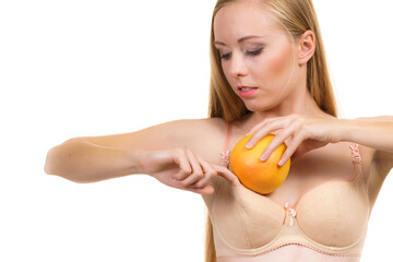 Woman small boobs puts big fruit in her bra