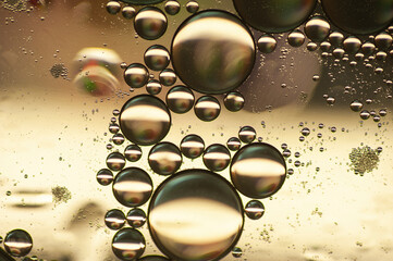 abstract background of oil bubbles in golden tones