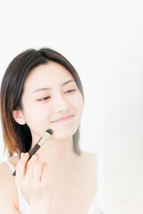 A beautiful young asian woman in make-up

