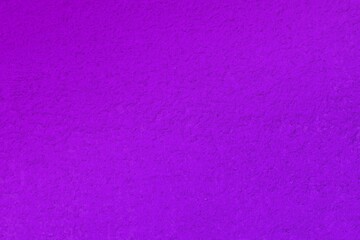 creative shabby purple travertine like plaster texture for use as background.