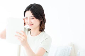A beautiful young asian woman in make-up

