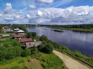 Fototapeta na wymiar View of a small Russian town and a wide river from a high hill