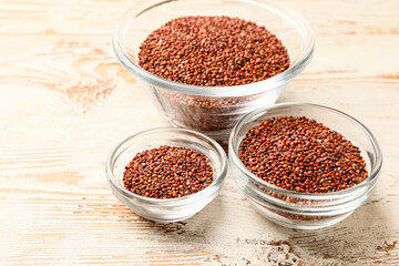 Obraz na płótnie Canvas Bowls with healthy quinoa on table