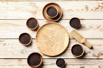 Fototapeta na wymiar Bowls with healthy quinoa on table