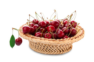 Basket with sweet cherry on white background