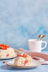 Delicious meringue roll with strawberry on color background