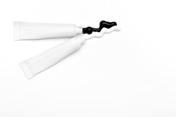 Different paints on white background. Racism concept